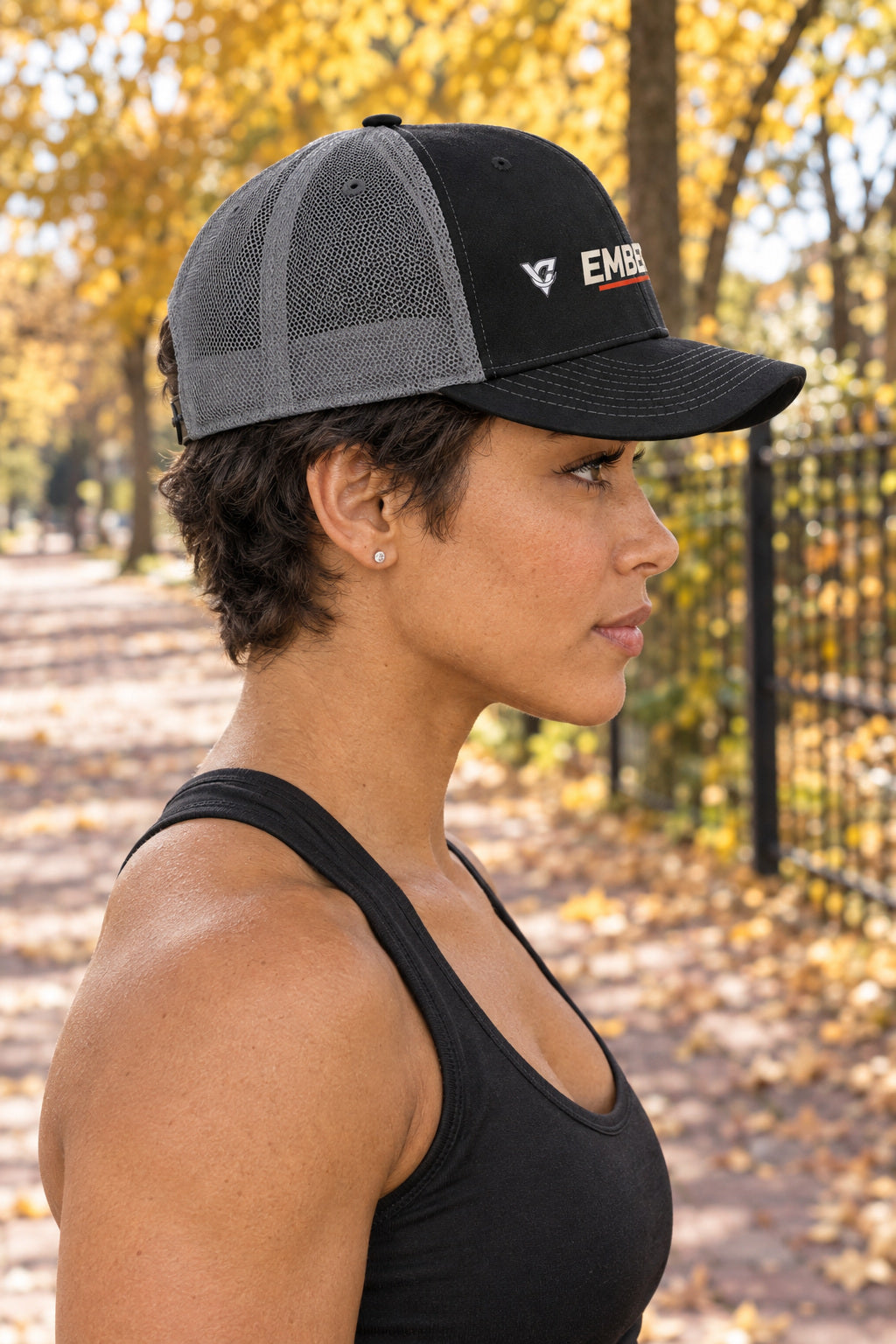 Ember Trucker Cap — Vantacore Snapback Hat, AI-generated side-profile product mockup on a fictional adult model