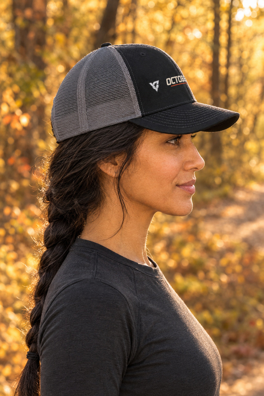 October Trucker Cap — Vantacore Snapback Hat, AI-generated side-profile product mockup on a fictional adult model