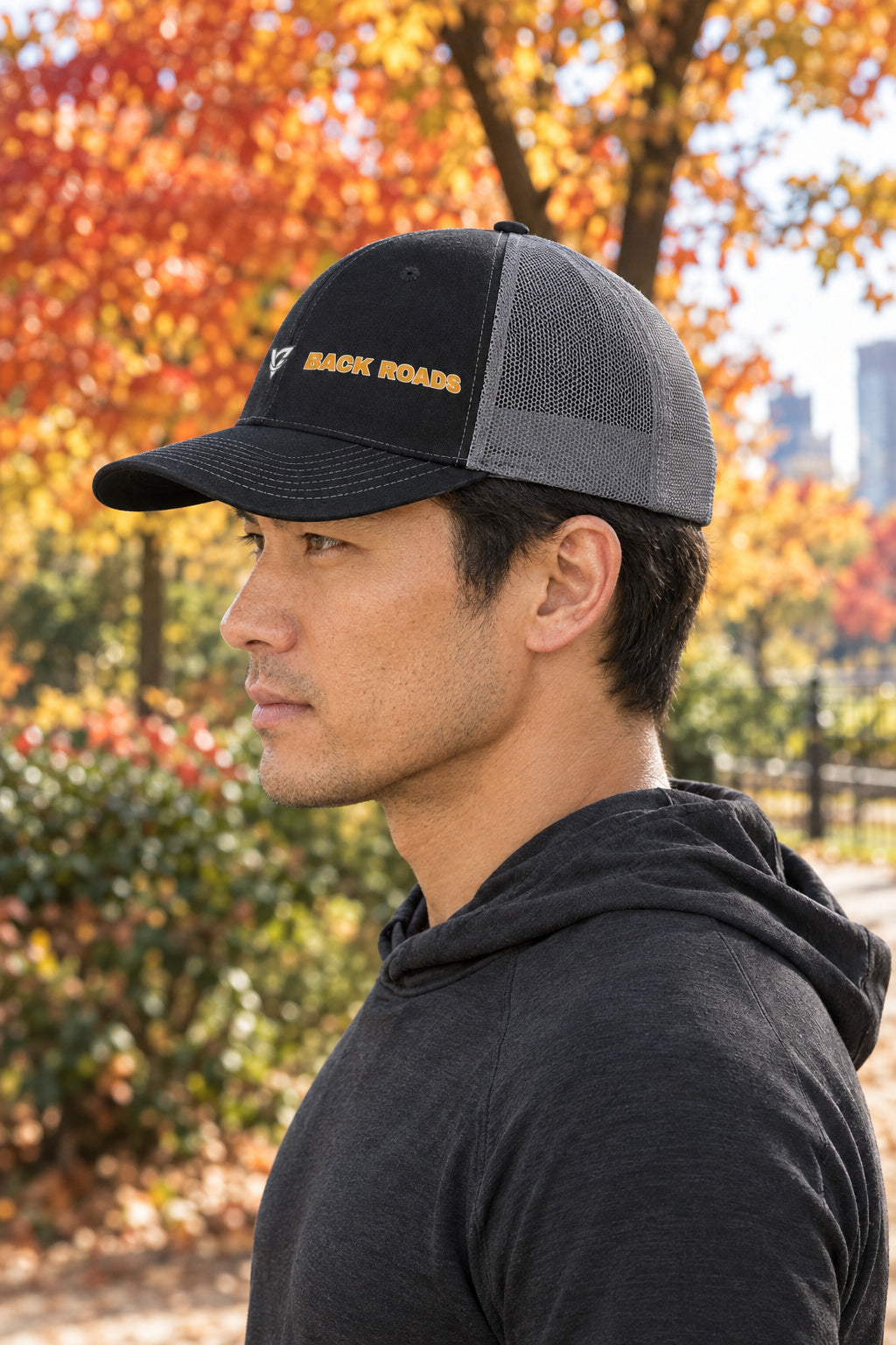Back Roads Trucker Cap — Vantacore Snapback Hat, AI-generated side-profile product mockup on a fictional adult model