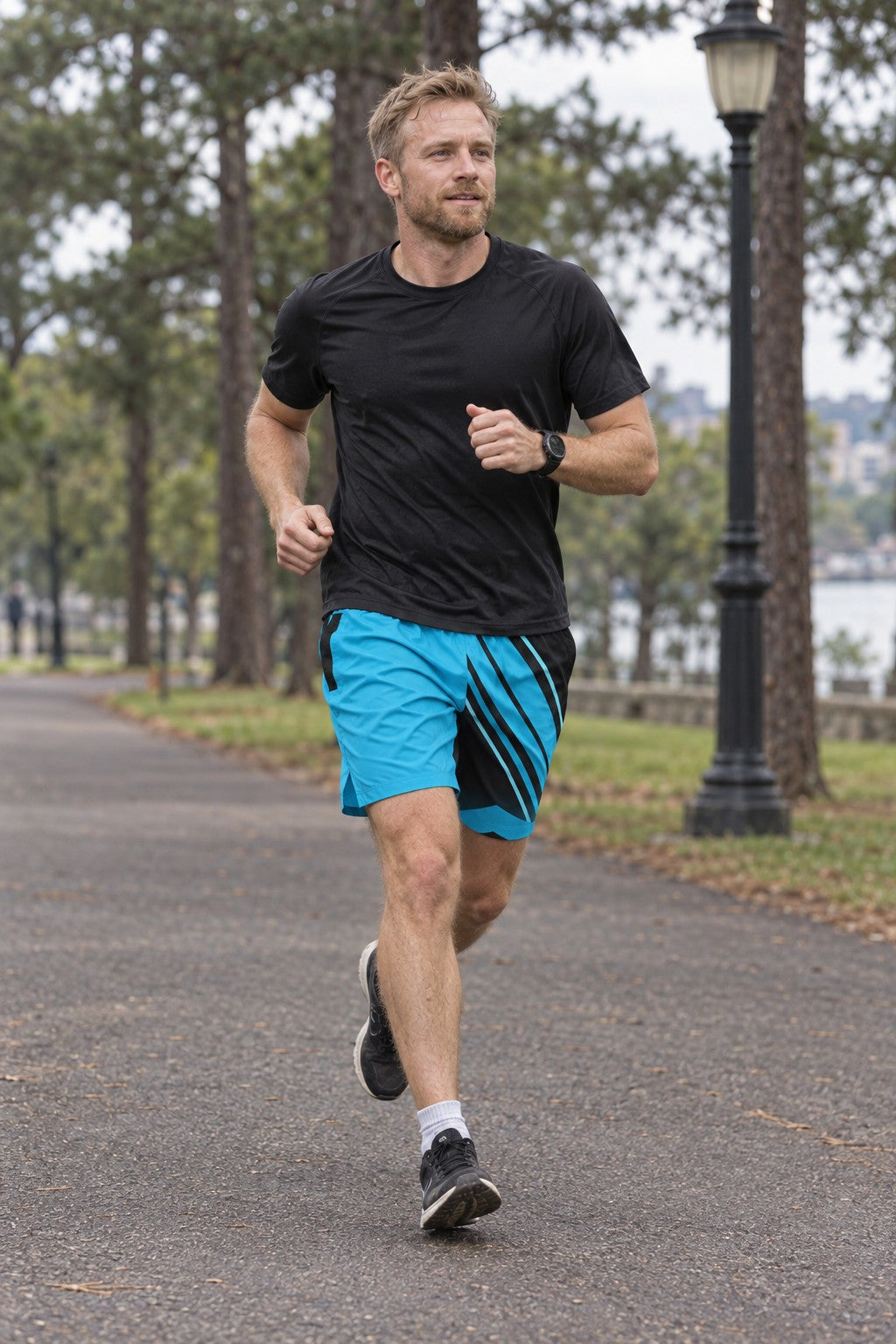 Runner wearing Men's Electric Cyan & Black Running Jogger Shorts with Pockets — Athletic Performance AOP
