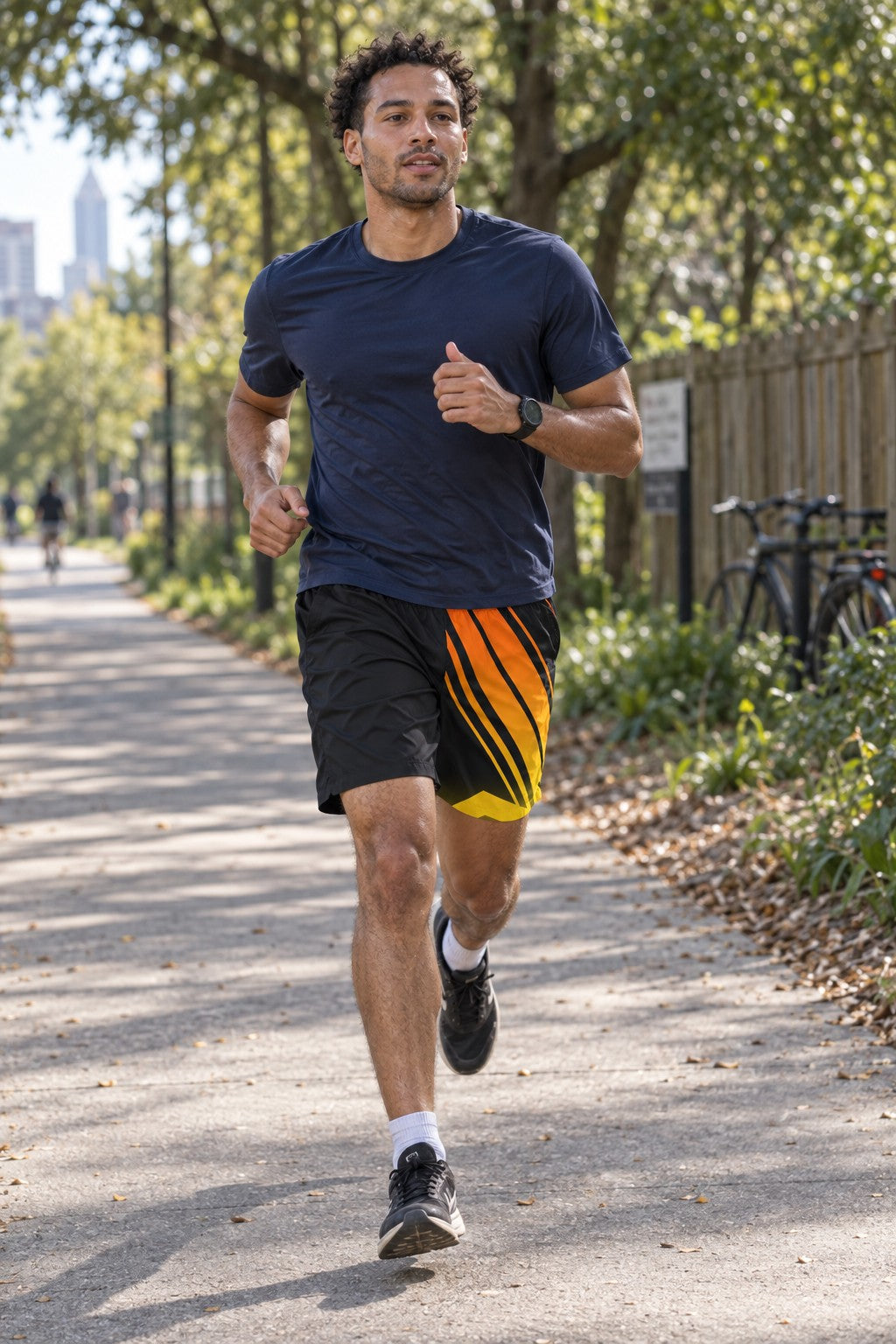Runner wearing Men's Black Flame Orange & Yellow Running Jogger Shorts with Pockets — Athletic Performance AOP
