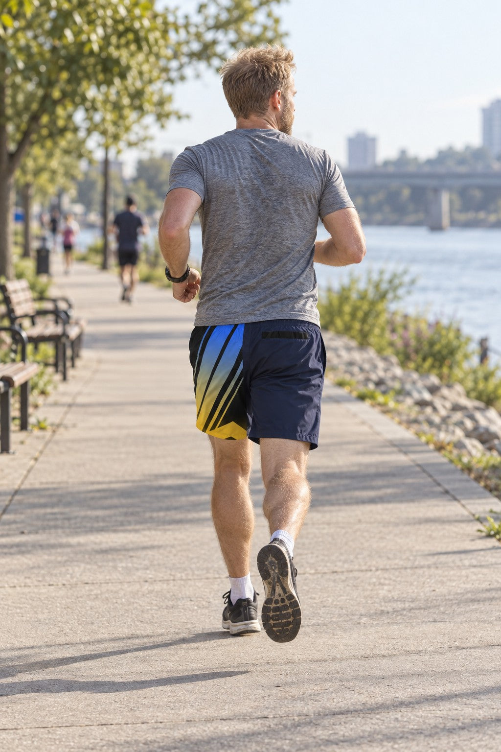 Runner wearing Men's Retro Lightning Blue & Gold Running Jogger Shorts with Pockets — Athletic Performance AOP — rear view
