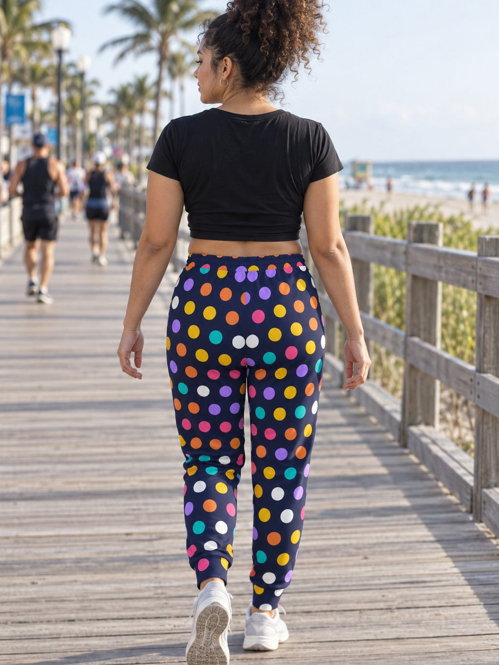 Woman wearing Vantacore Polka Pop all-over print joggers, back view