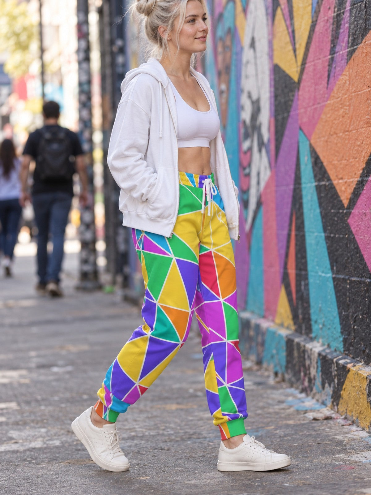 Woman wearing Vantacore Prism Shards all-over print joggers, side view