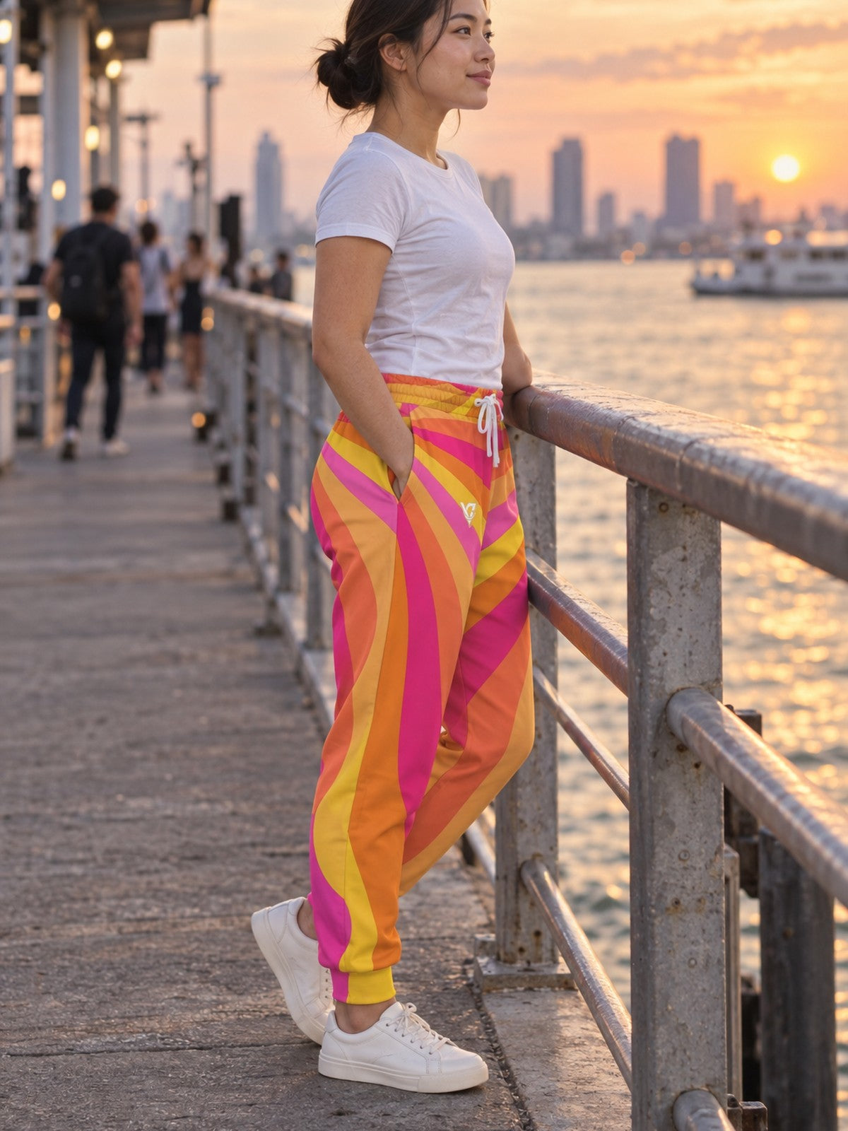 Woman wearing Vantacore Sunburst Rays all-over print joggers, side view