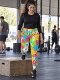 Woman wearing Vantacore Citrus Splash all-over print joggers, front view