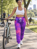 Woman wearing Vantacore Galaxy Glow all-over print joggers, front view