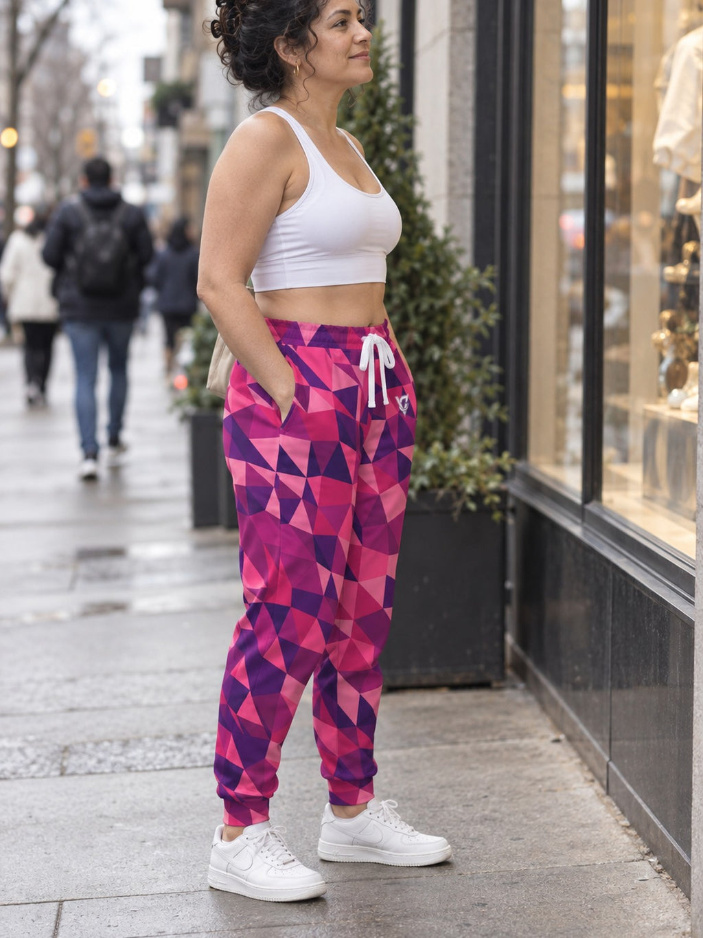 Woman wearing Vantacore Berry Mosaic all-over print joggers, side view