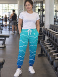 Woman wearing Vantacore Ocean Ombre all-over print joggers, front view