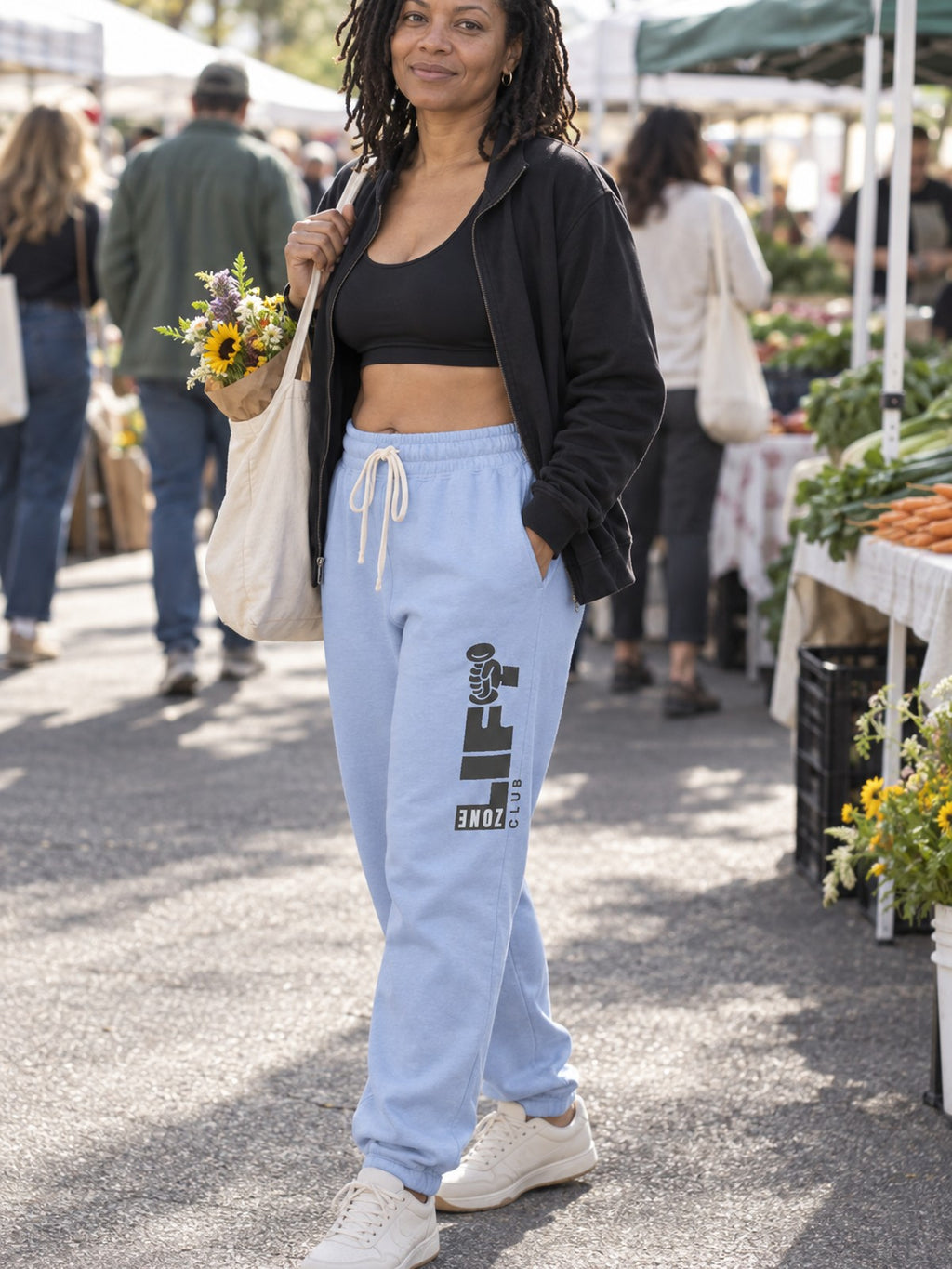 Woman wearing Vantacore LIFT Zone Club graphic sweatpants in Hydrangea, three-quarter view