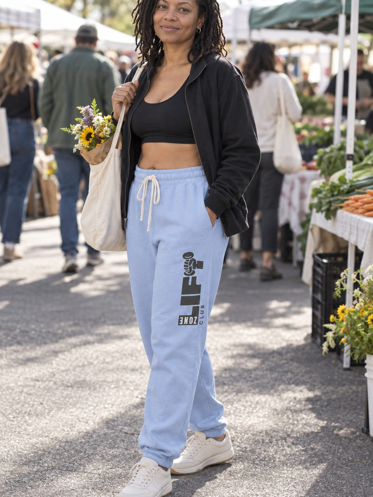 Woman wearing Vantacore LIFT Zone Club graphic sweatpants in Hydrangea, three-quarter view