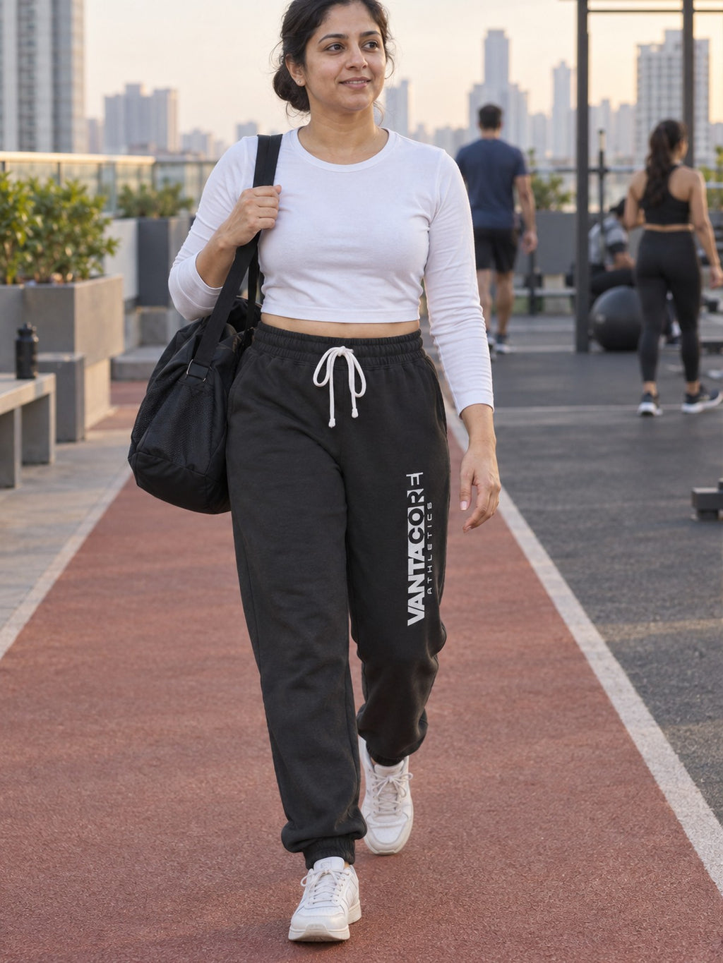 Woman wearing Vantacore Vantacore Athletics logo sweatpants in Black, front view