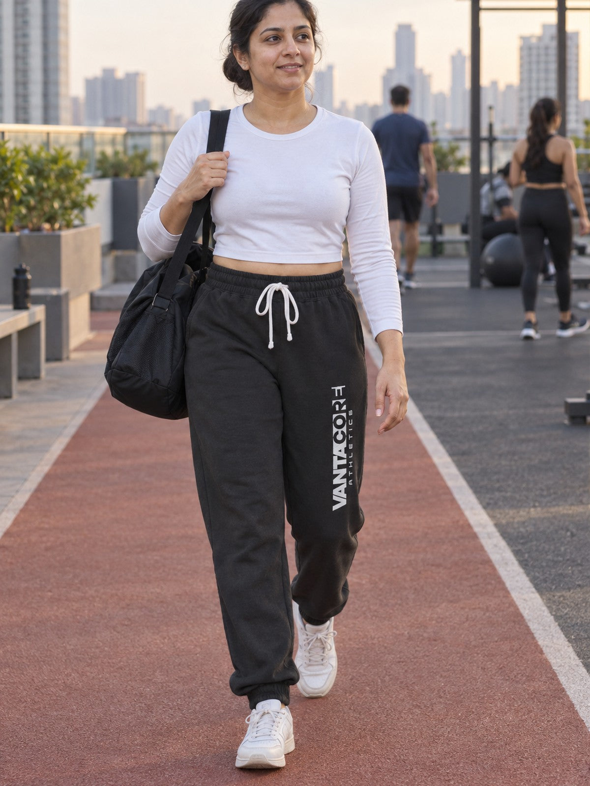 Woman wearing Vantacore Vantacore Athletics logo sweatpants in Black, front view
