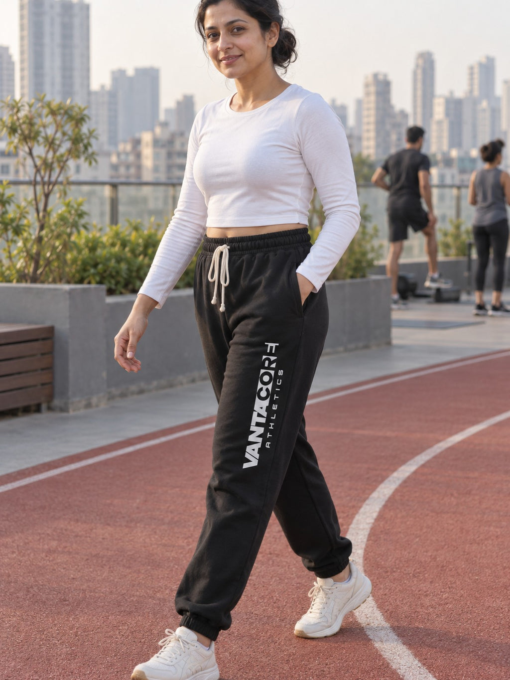 Woman wearing Vantacore Vantacore Athletics logo sweatpants in Black, three-quarter view