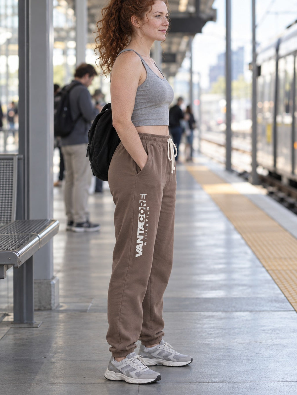 Woman wearing Vantacore Vantacore Athletics logo sweatpants in Espresso, side view