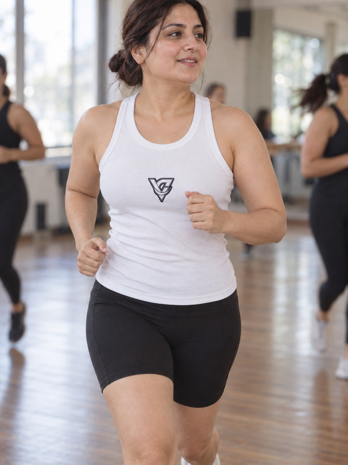 Woman wearing the Bold V Emblem Women's Racerback Tank