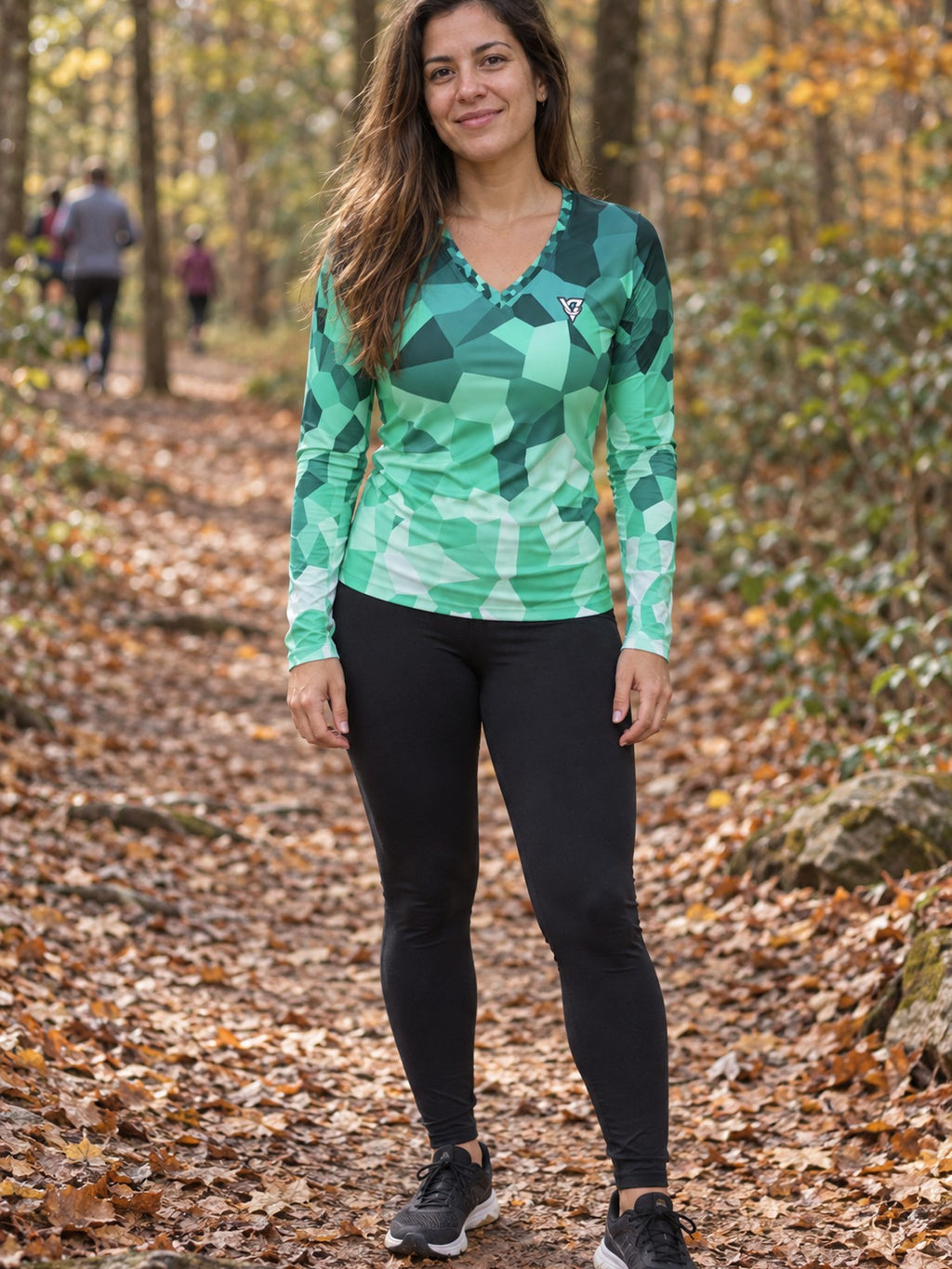 Woman wearing the Mint Shard Women's Long Sleeve V-Neck Athletic Top