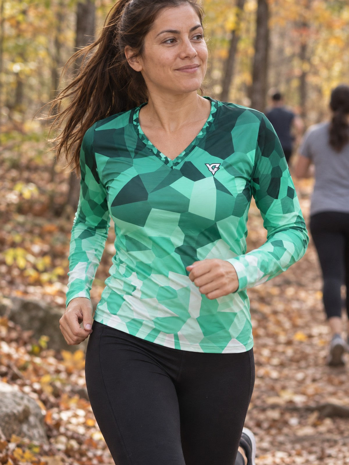 Woman wearing the Mint Shard Women's Long Sleeve V-Neck Athletic Top