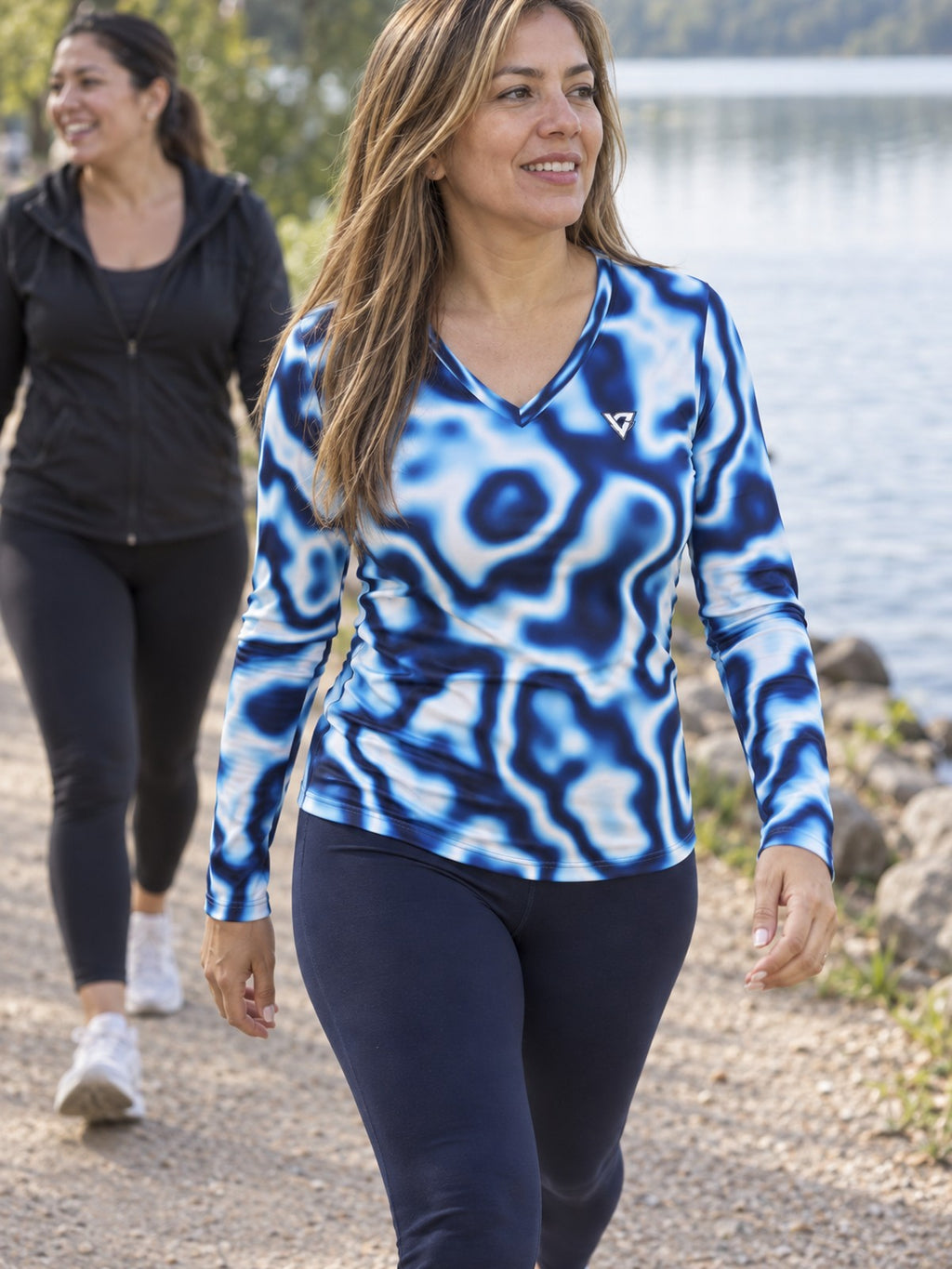 Woman wearing the Ocean Marble Women's Long Sleeve V-Neck Athletic Top