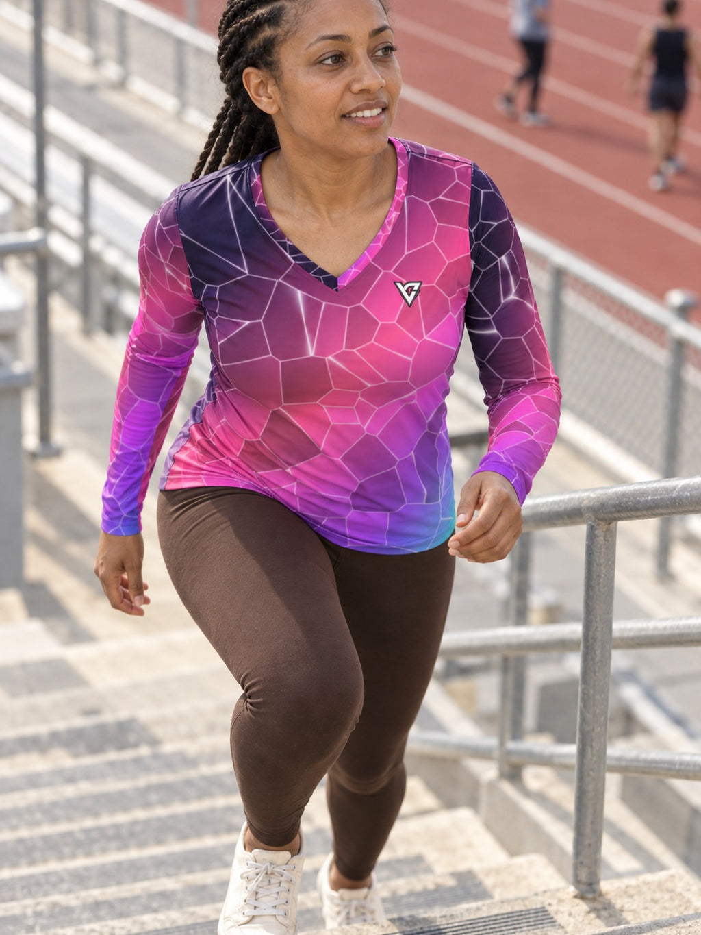 Woman wearing the Violet Shatter Women's Long Sleeve V-Neck Athletic Top