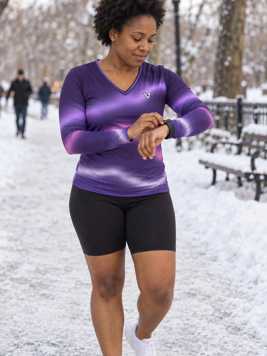 Woman wearing the Lilac Aurora Women's Long Sleeve V-Neck Athletic Top