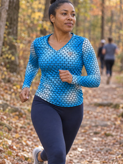 Woman wearing the Aqua Serpent Scale Women's Long Sleeve V-Neck Athletic Top