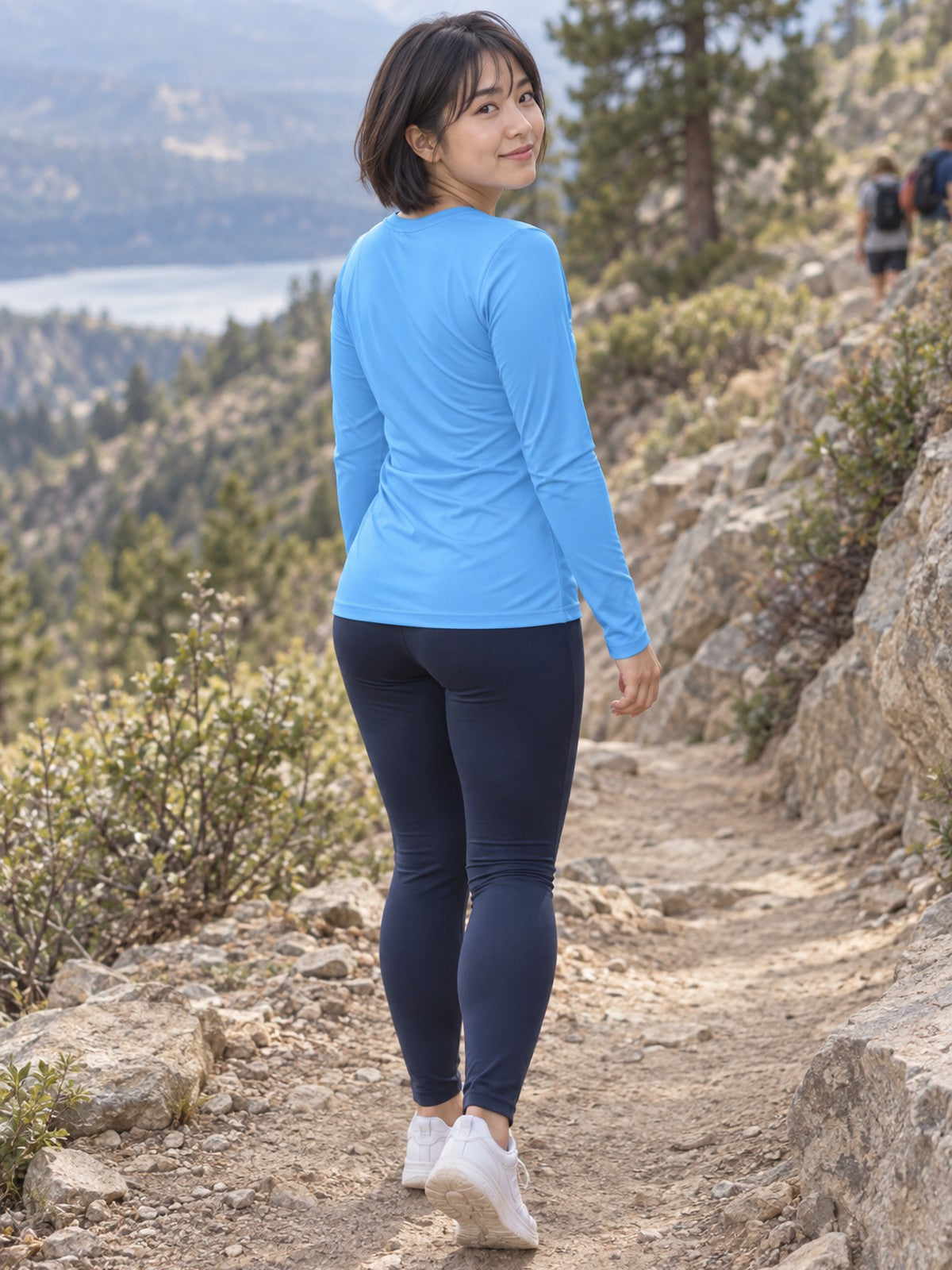 Woman wearing the Sky Blue Essential Women's Long Sleeve V-Neck Athletic Top