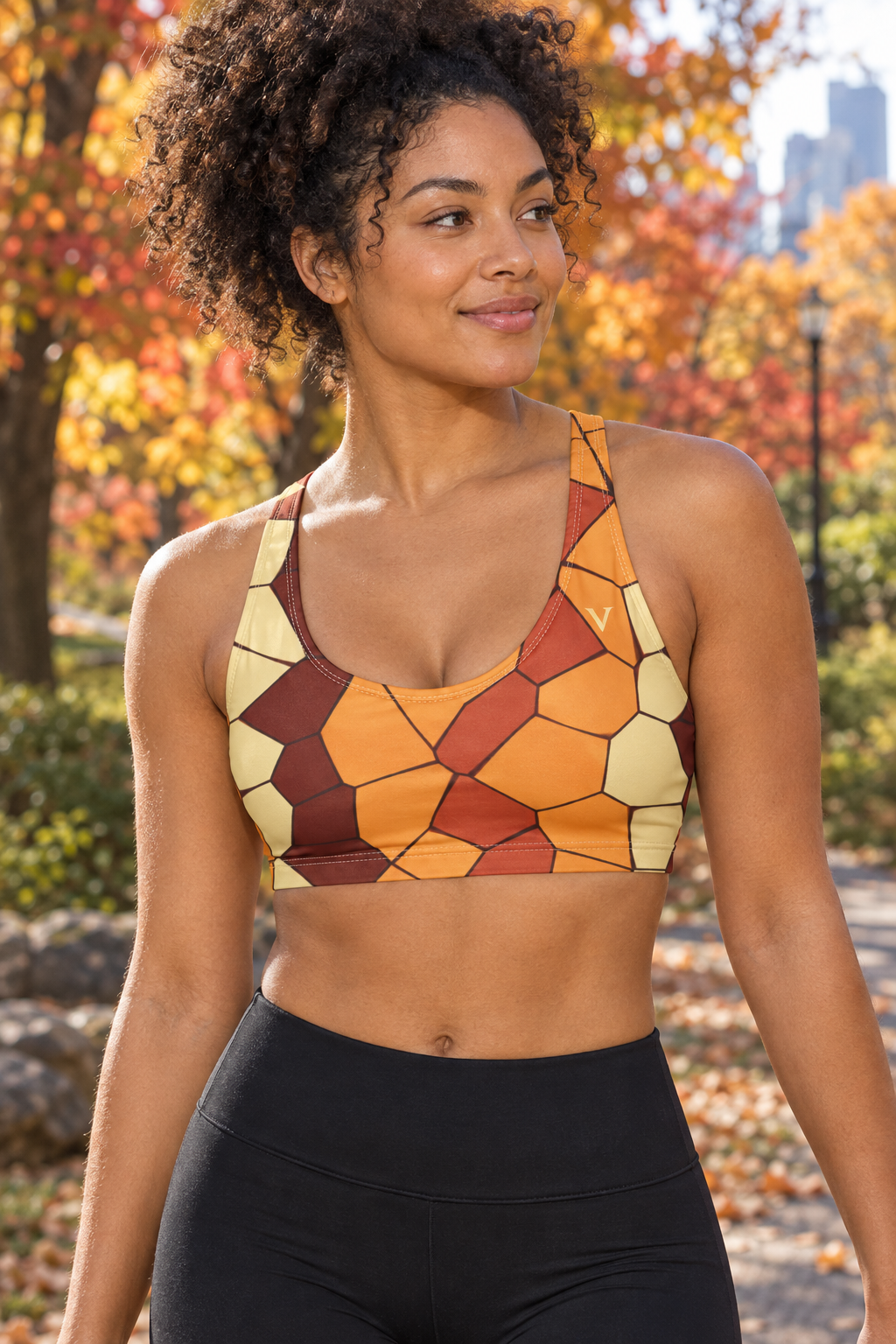 Golden Hour Mosaic women's scoop-neck sports bra worn on a model