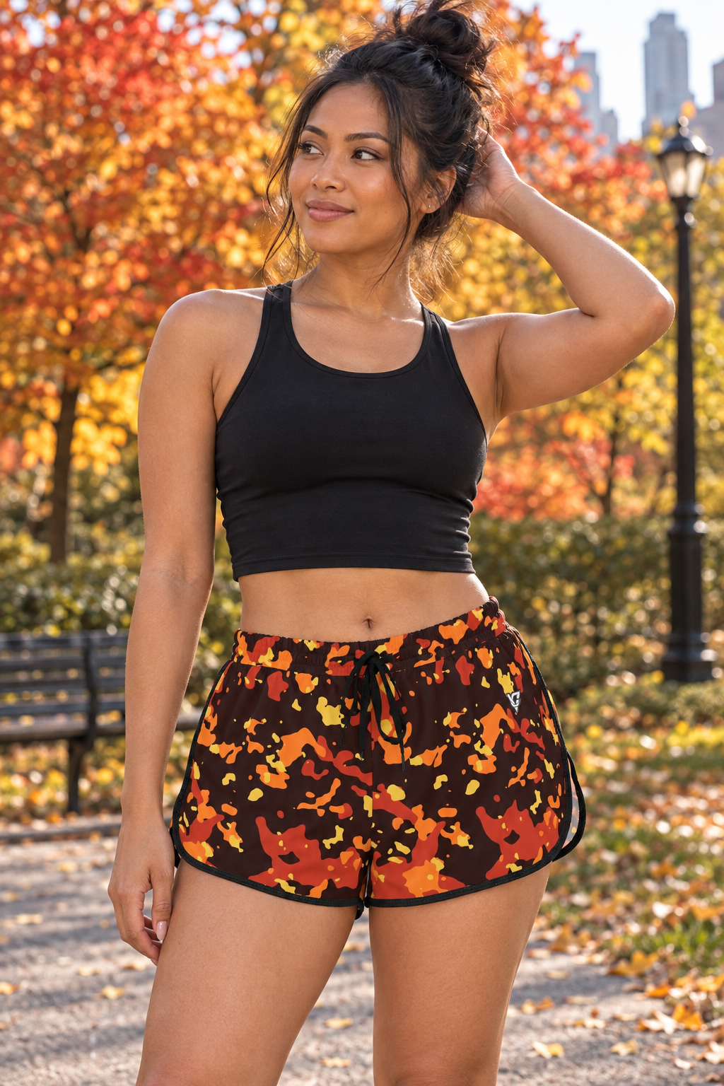 Sunset Orchard Splatter women's relaxed running shorts worn on a model