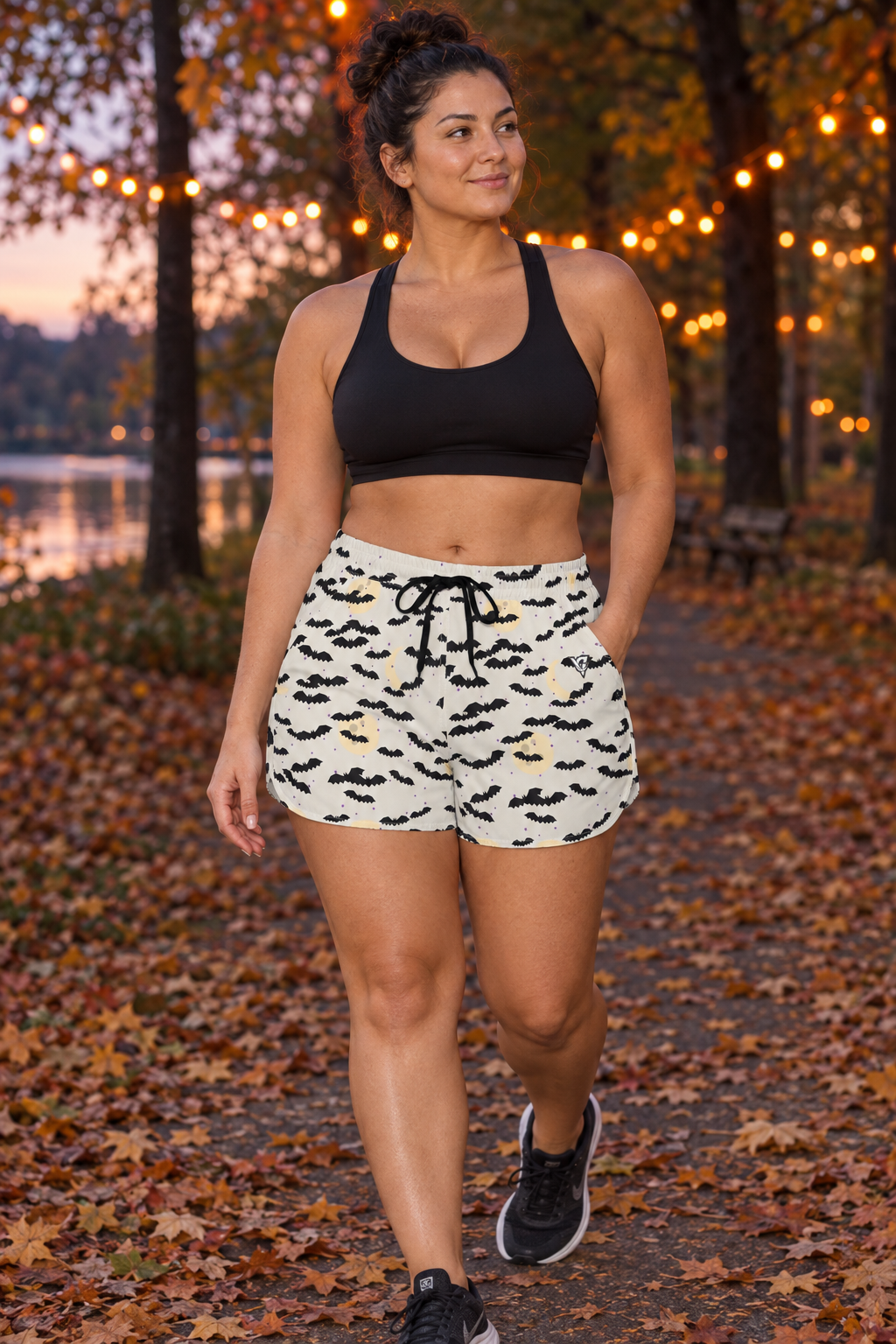 Halloween Bone White Bat Swarm women's lightweight athletic shorts worn on a model