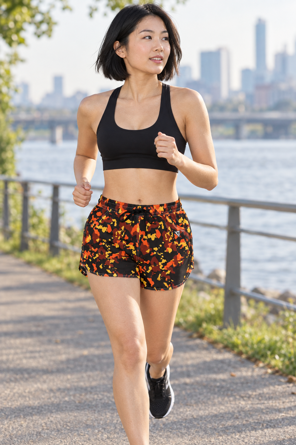 Ember Splatter women's lightweight athletic shorts worn on a model