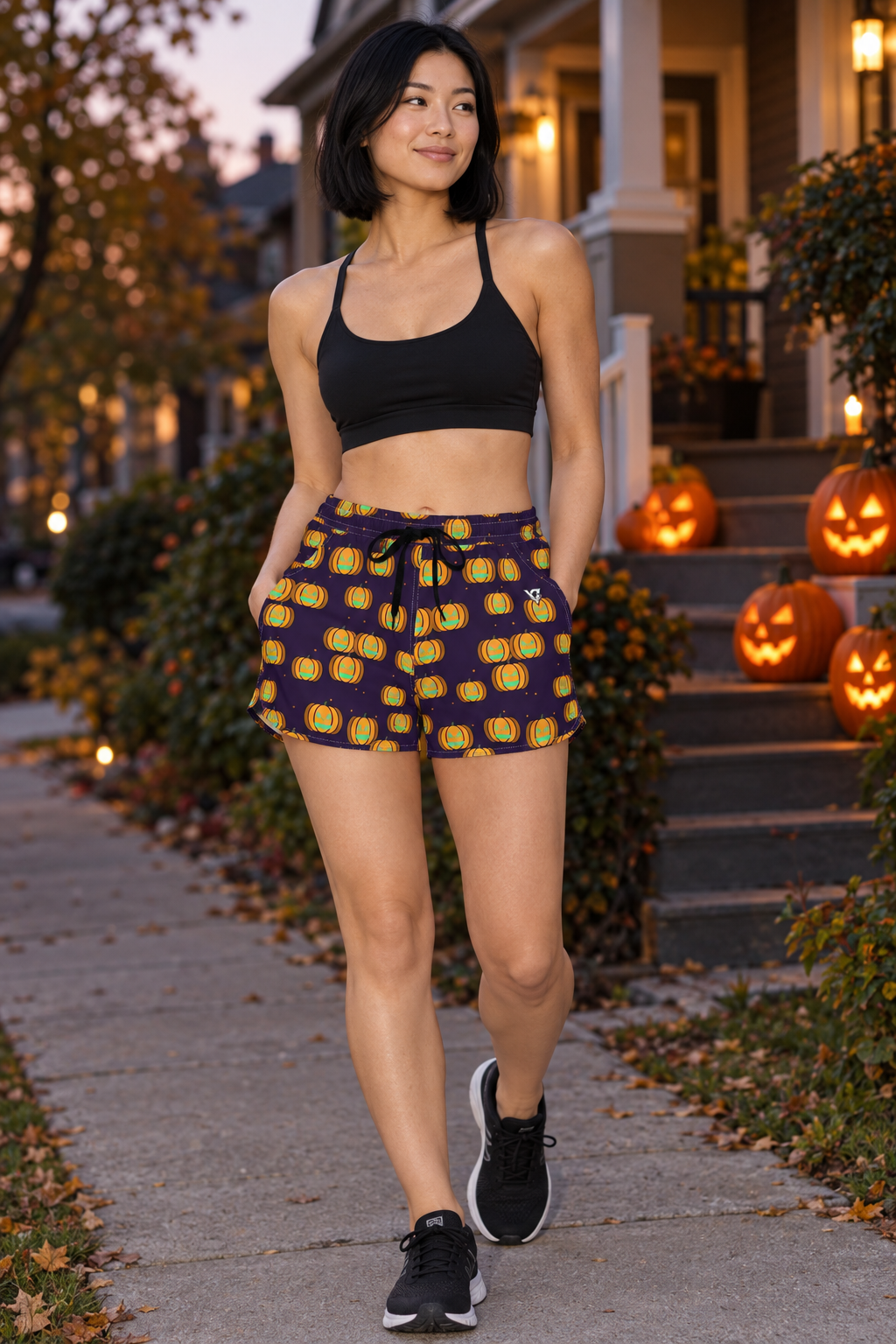 Halloween Hocus Pocus Jack-O'-Lantern women's lightweight athletic shorts worn on a model