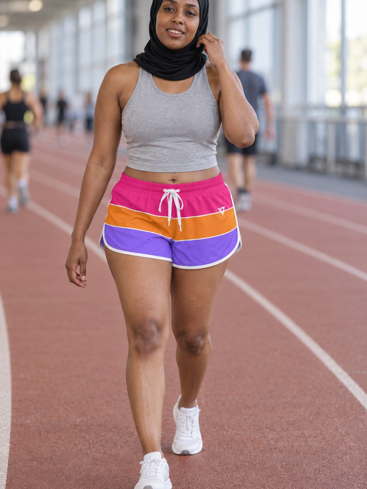 Woman wearing the Color Block Pop relaxed all-over print shorts – front view
