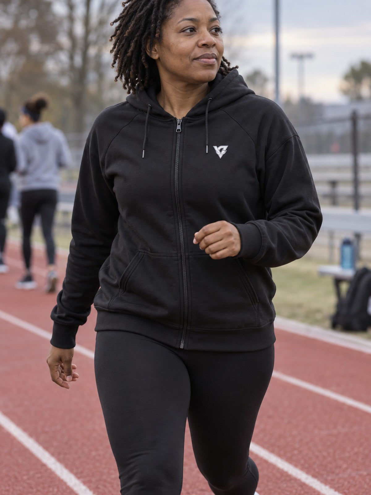 Woman wearing the Lilac Magma Women's Hooded Training Jacket