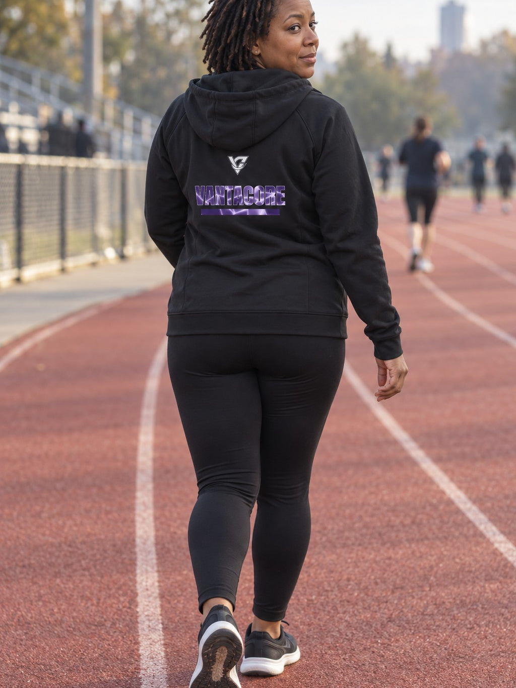Woman wearing the Lilac Magma Women's Hooded Training Jacket