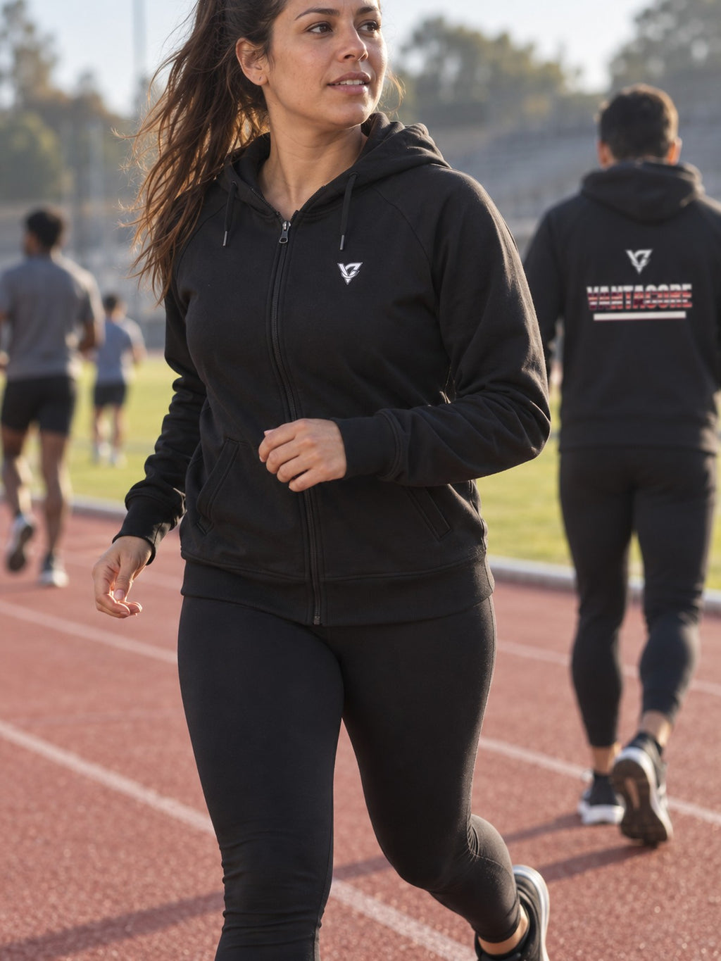 Woman wearing the Coral Glitch Women's Hooded Training Jacket