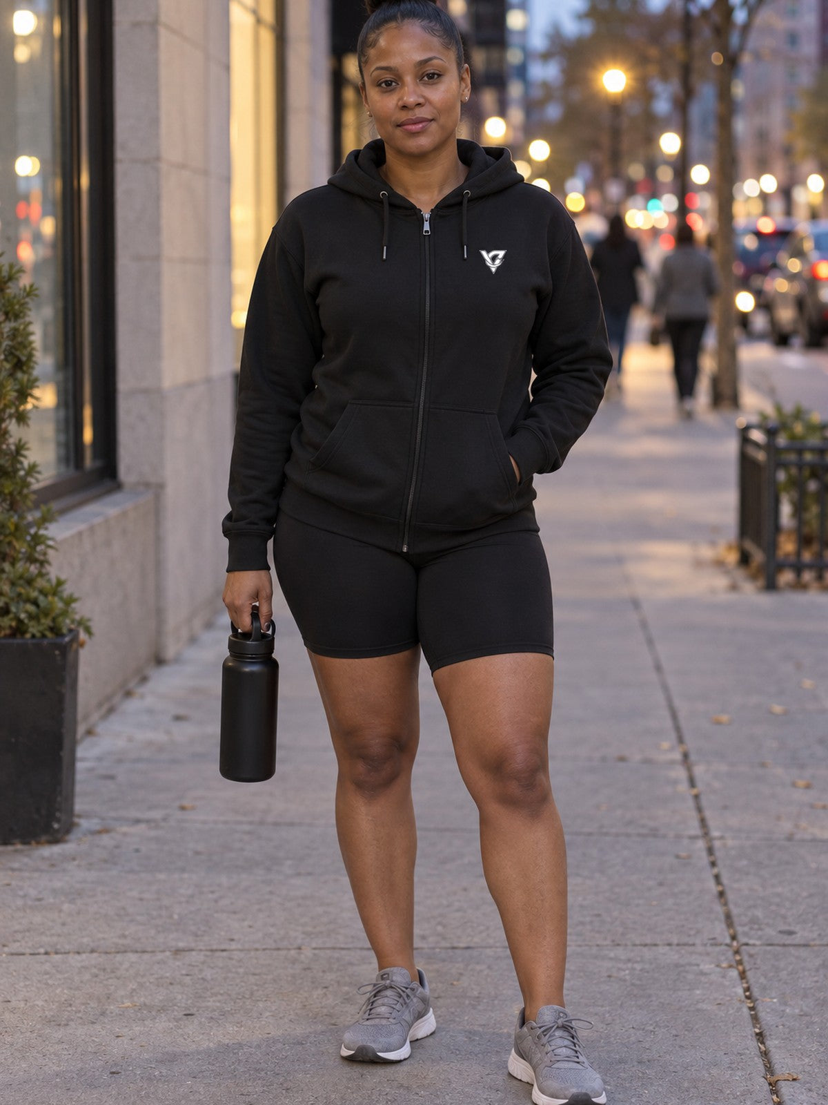 Woman wearing the Aqua Tiger Stripe Women's Hooded Training Jacket