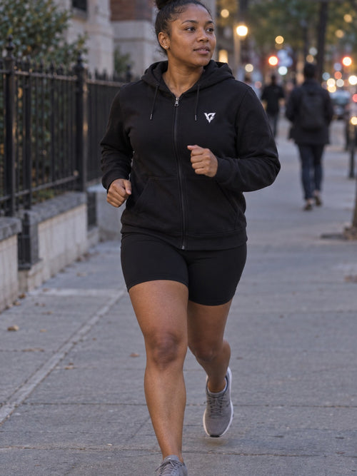 Woman wearing the Aqua Tiger Stripe Women's Hooded Training Jacket
