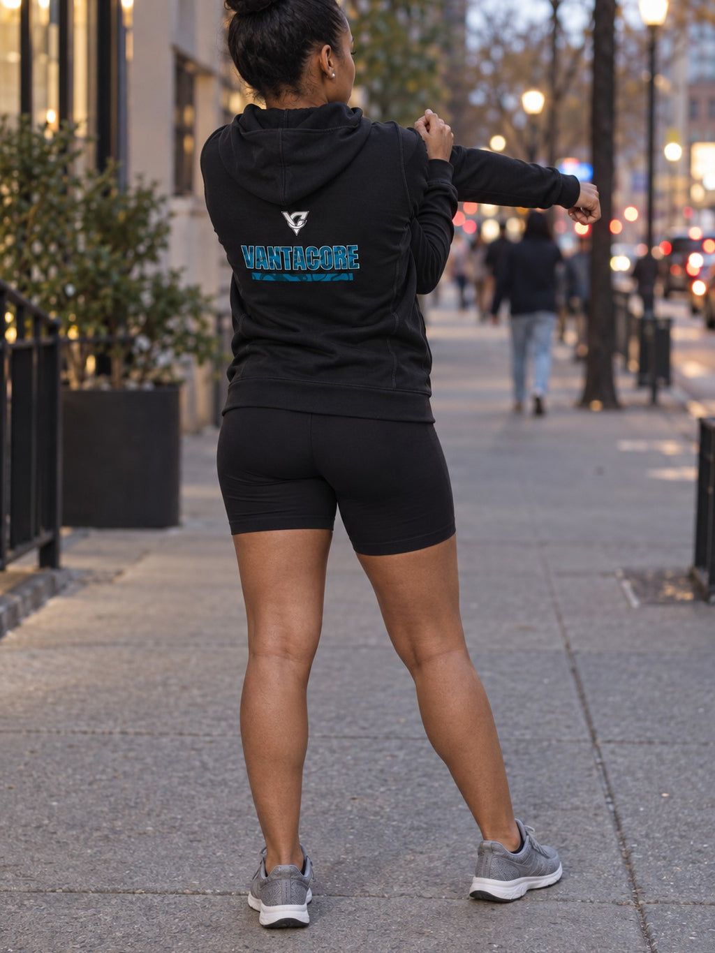 Woman wearing the Aqua Tiger Stripe Women's Hooded Training Jacket