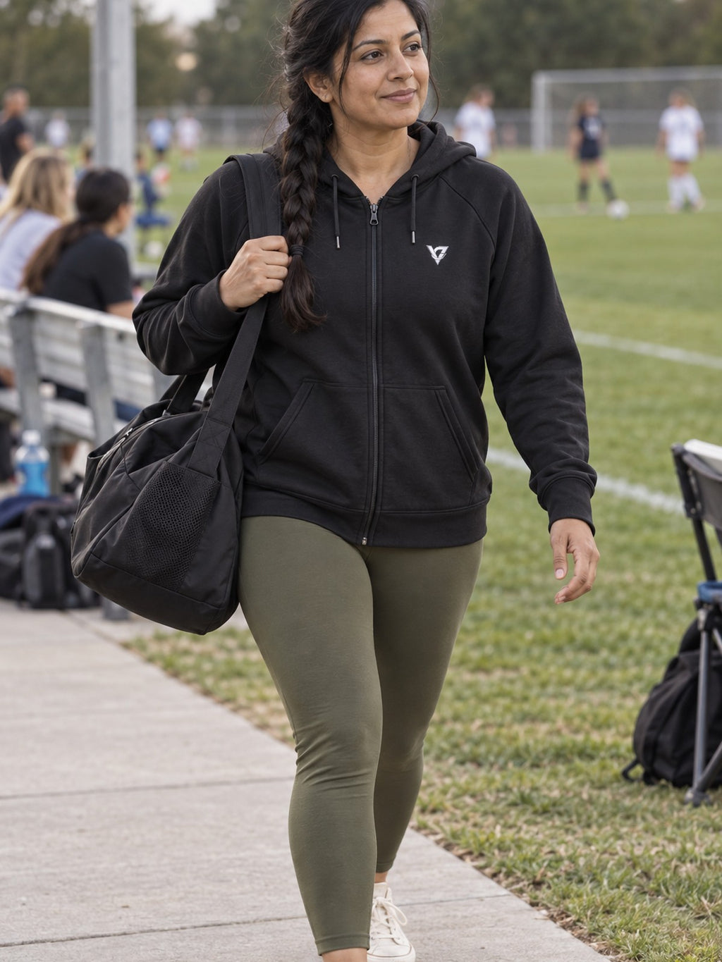 Woman wearing the Classic V Logo Women's Hooded Training Jacket