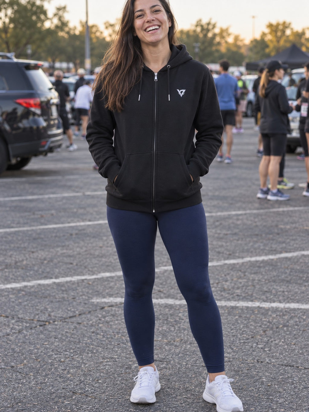 Woman wearing the Signature V Women's Hooded Training Jacket