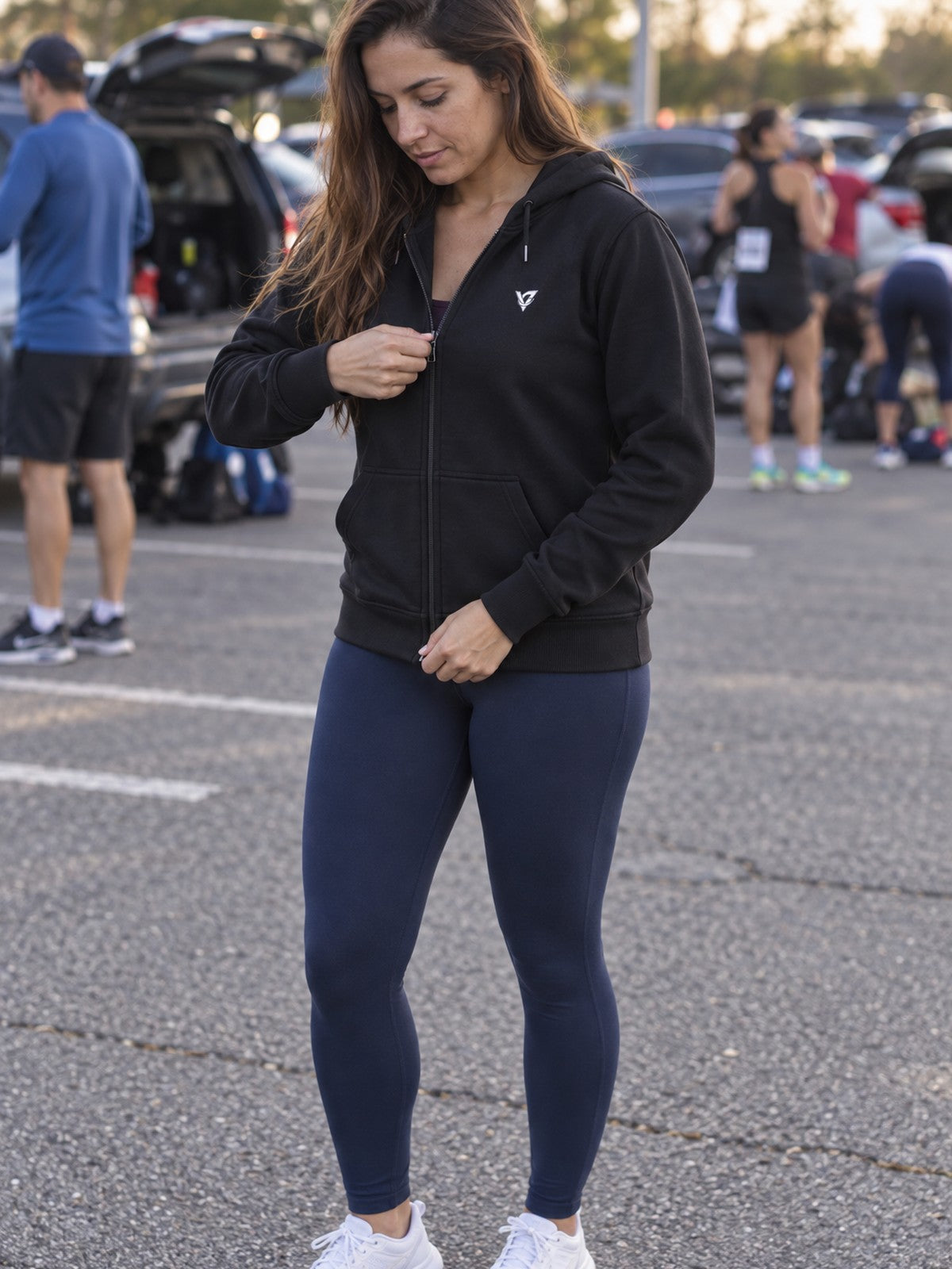 Woman wearing the Signature V Women's Hooded Training Jacket