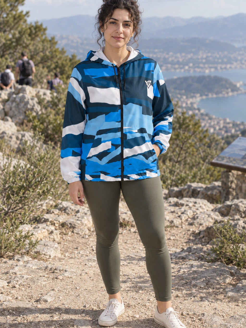 Woman wearing the Aqua Brushstroke Women's Windbreaker Jacket