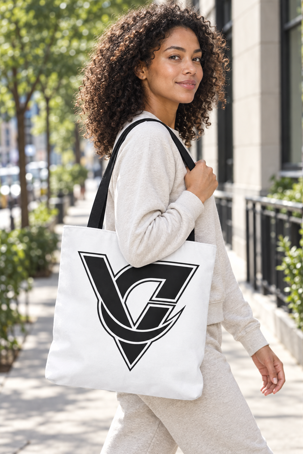 Monogram V Triangle Tote Bag worn on a model